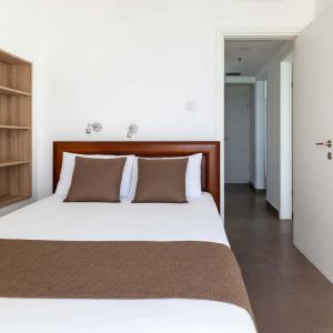 Ένα ή περισσότερα κρεβάτια σε δωμάτιο στο O&O Group - Iconic Tower 3BR Frontline Sea View