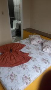 Ένα ή περισσότερα κρεβάτια σε δωμάτιο στο Pousada Moura