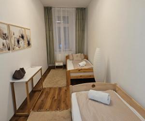 a small room with a bed and a table at Olymp in Bamberg