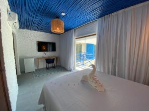 En eller flere senge i et værelse på Hotel Boutique Silvano Gourmet + 29 billeder