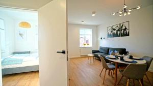 Ένα ή περισσότερα κρεβάτια σε δωμάτιο στο Apartamenty EverySky Kowary, 1-go Maja 62