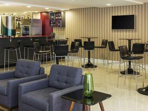 TV a/nebo společenská místnost v ubytování Mercure Ribeirão Preto