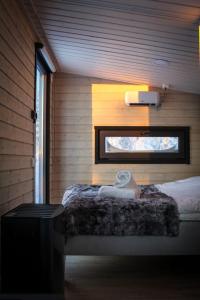 Ένα ή περισσότερα κρεβάτια σε δωμάτιο στο Palas Experience Olkkajärvi Resort