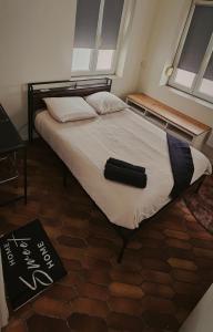 Ένα ή περισσότερα κρεβάτια σε δωμάτιο στο Le cœur d'Arras 1