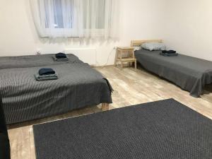 Giường trong phòng chung tại Huszonnyolcpera