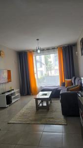 Χώρος καθιστικού στο Legatus Cozy Homes