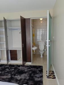 Ένα μπάνιο στο Legatus Cozy Homes