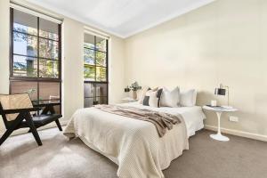 Кровать или кровати в номере Walk to Grand Prix and St Kilda Beach