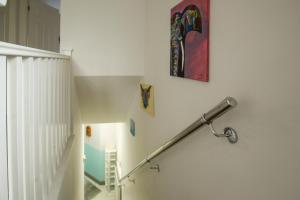 a staircase with a metal hand rail on a wall at Modern 3-Bedroom Home in Quiet Cul-de-Sac w Parking by Rework Accommodation in Saltney +32 photos