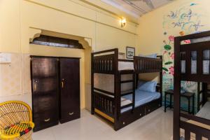 Postel nebo postele na pokoji v ubytování Kalyan Villa Homestay