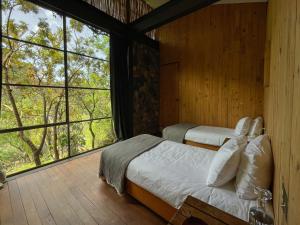 Postel nebo postele na pokoji v ubytování El Sereno Amatlán, Tepoztlán + 89 fotografií