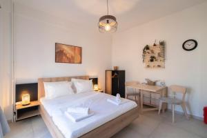 Ένα ή περισσότερα κρεβάτια σε δωμάτιο στο UrbanKeys Athens