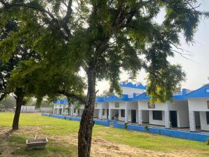 a row of buildings with blue roofs at Pushkar Prime Resort in Pushkar