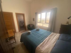 Voodi või voodid majutusasutuse Sunset Views Apartment Flat toas