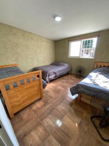 Giường trong phòng chung tại Los viejos Potrero de Garay