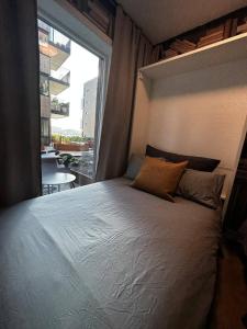 Ένα ή περισσότερα κρεβάτια σε δωμάτιο στο Kristiansand