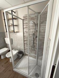 a shower with a glass door in a bathroom at Ca' da Lisa in San Colombano Certenoli +13 photos
