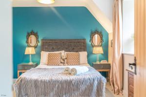 Postel nebo postele na pokoji v ubytování Neuadd-Dolwyddelan