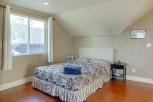 a bedroom with a bed with a blue pillow on it at 5 Mi to Jack London Square Apt with Shared Yard in Alameda