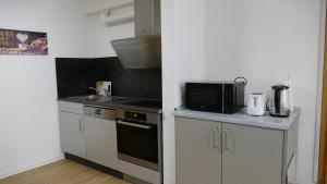 Kuchyň nebo kuchyňský kout v ubytování Ferienwohnung Wendel