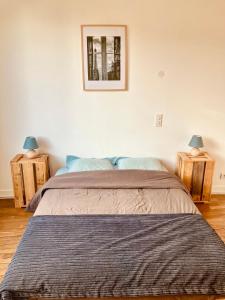 Ένα ή περισσότερα κρεβάτια σε δωμάτιο στο Entre Terre et Baie du Mont-Saint-Michel