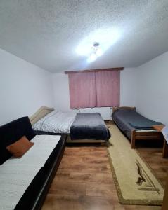 En eller flere senge i et værelse på Vila AT