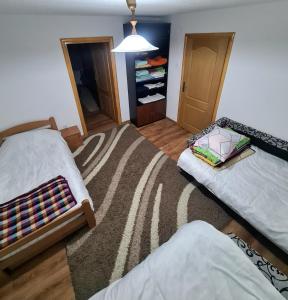 En eller flere senge i et værelse på Vila AT