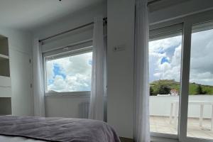 Ένα ή περισσότερα κρεβάτια σε δωμάτιο στο Principado de Aracena I