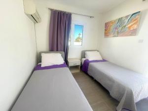 Postel nebo postele na pokoji v ubytování Christina Apartment