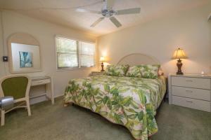 En eller flere senge i et værelse på Makani A Kai Resort A-3 + 34 billeder