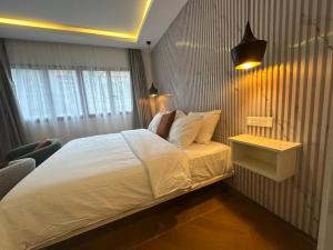 Ліжко або ліжка в номері Bark Luxury Appartments au Plateau Abidjan