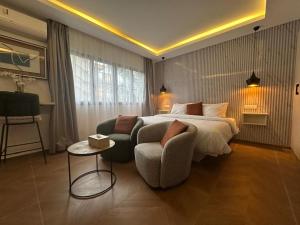 Ліжко або ліжка в номері Bark Luxury Appartments au Plateau Abidjan +62 фото