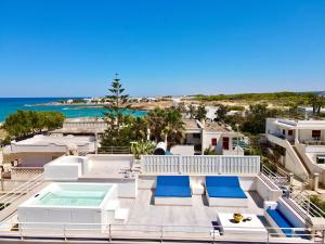 a villa with a view of the ocean at Attico Mezzaluna by BarbarHouse in Torre Santa Sabina