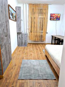 Voodi või voodid majutusasutuse Parcul Ștefan cel mare toas