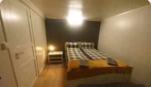 Ένα ή περισσότερα κρεβάτια σε δωμάτιο στο Aurora Rooms