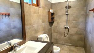 a bathroom with a shower and a sink and a toilet at Heaven in Satinwoods in Tangalle +78 photos
