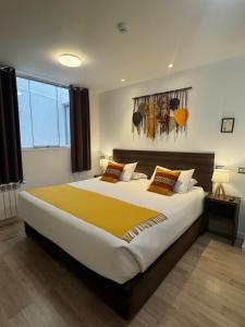 a bedroom with a large bed in a room at CASA CRISTOBAL Centenario in Cusco