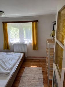 a bedroom with a bed and a window at Ferienhütte Admont in Admont