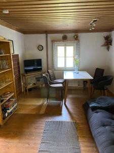 a living room with a table and a couch at Ferienhütte Admont in Admont