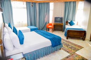 Postel nebo postele na pokoji v ubytování فندق عرفه الجديد + 50 fotografií