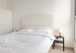 Ένα ή περισσότερα κρεβάτια σε δωμάτιο στο O&O Group - Sea View Tower - 32nd Floor Parking