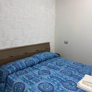 Postel nebo postele na pokoji v ubytování monolocale + 5 fotografií