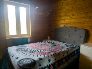 a bedroom with a bed with a blanket on it at Secret Garden in Grottolella