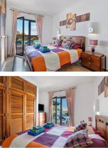 2 Betten in einem Schlafzimmer mit Meerblick in der Unterkunft Villa Tania - Villa independiente con piscina privada in Playa Blanca