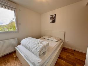 A bed or beds in a room at Appartement 4 pers à 200m du Skyvall