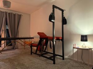 a room with a table and a chair and a mirror at The Secret Stay In Walsall in Walsall