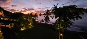 a view of the ocean at sunset from a resort at Fare Tupaia in Arue