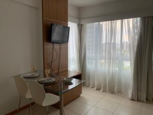 Μια τηλεόραση ή/και κέντρο ψυχαγωγίας στο Saint Moritz - Conforto e Localização Imbatível