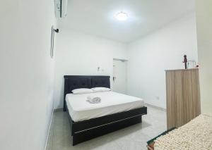 Ένα ή περισσότερα κρεβάτια σε δωμάτιο στο Cloud Nest Hanthana