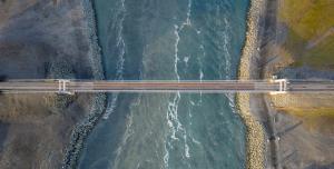 an aerial view of a bridge over the water at Guesthouse Mikael in Höfn